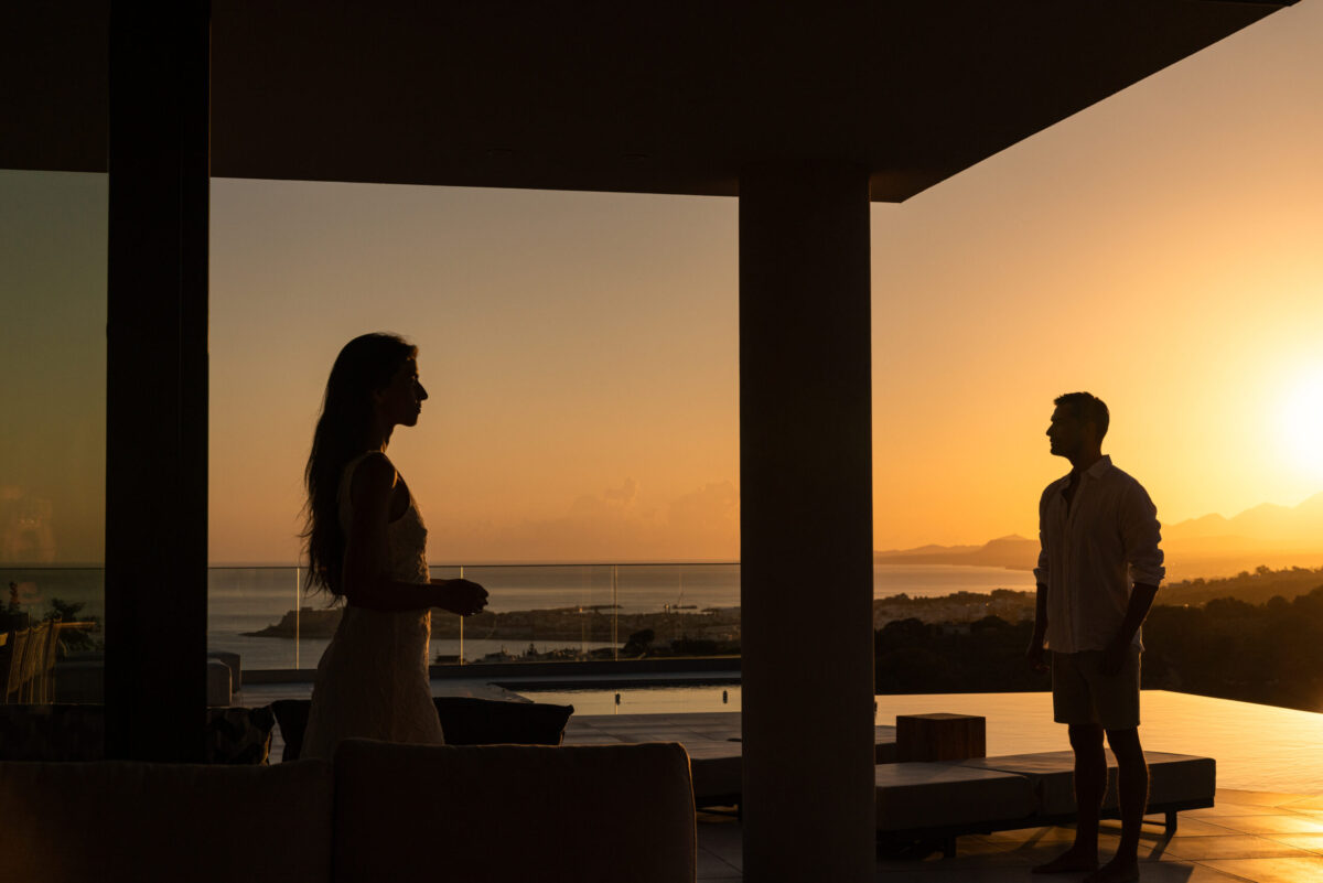 A WOMAN AND A MAN DURING SUNSET AT AERIAL VILLA